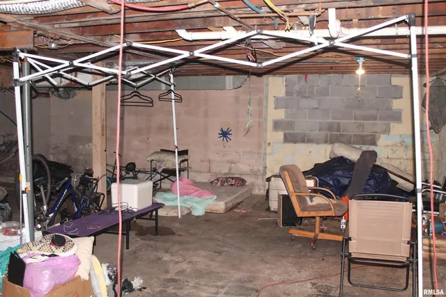 a view of a patio with a table and chairs