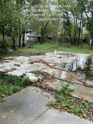 a backyard of a house with a yard and trampoline