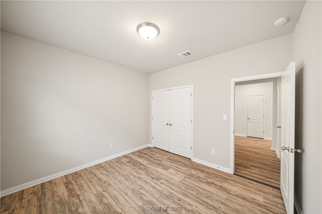 2018 Brisbane Way Bryan, TX 77807 - Photo 16 of 39 a view of a room with wooden floor