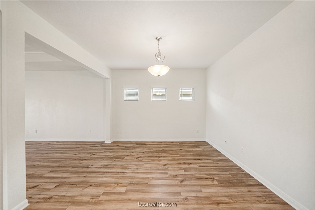 2018 Brisbane Way Bryan, TX 77807 - Photo 17 of 39 a view of a room with wooden floor and white walls