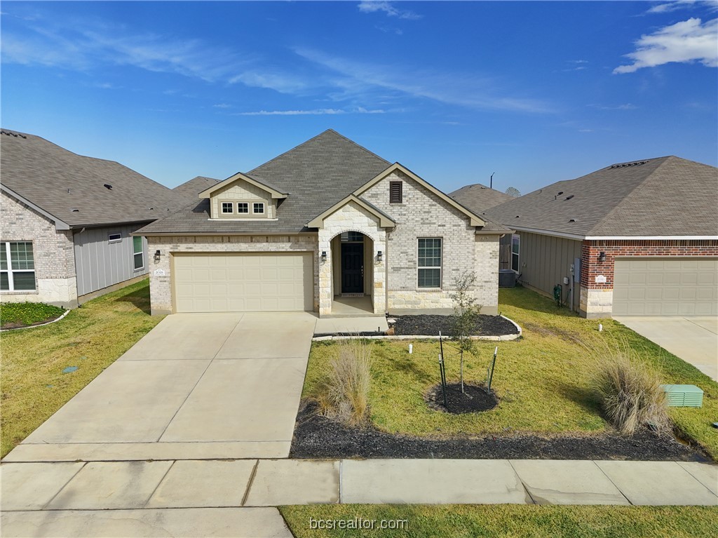 2018 Brisbane Way Bryan, TX 77807 - Photo 3 of 39 a front view of a house with swimming pool