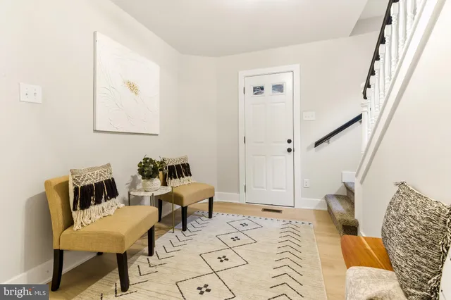 a bed room with a bed and a chair