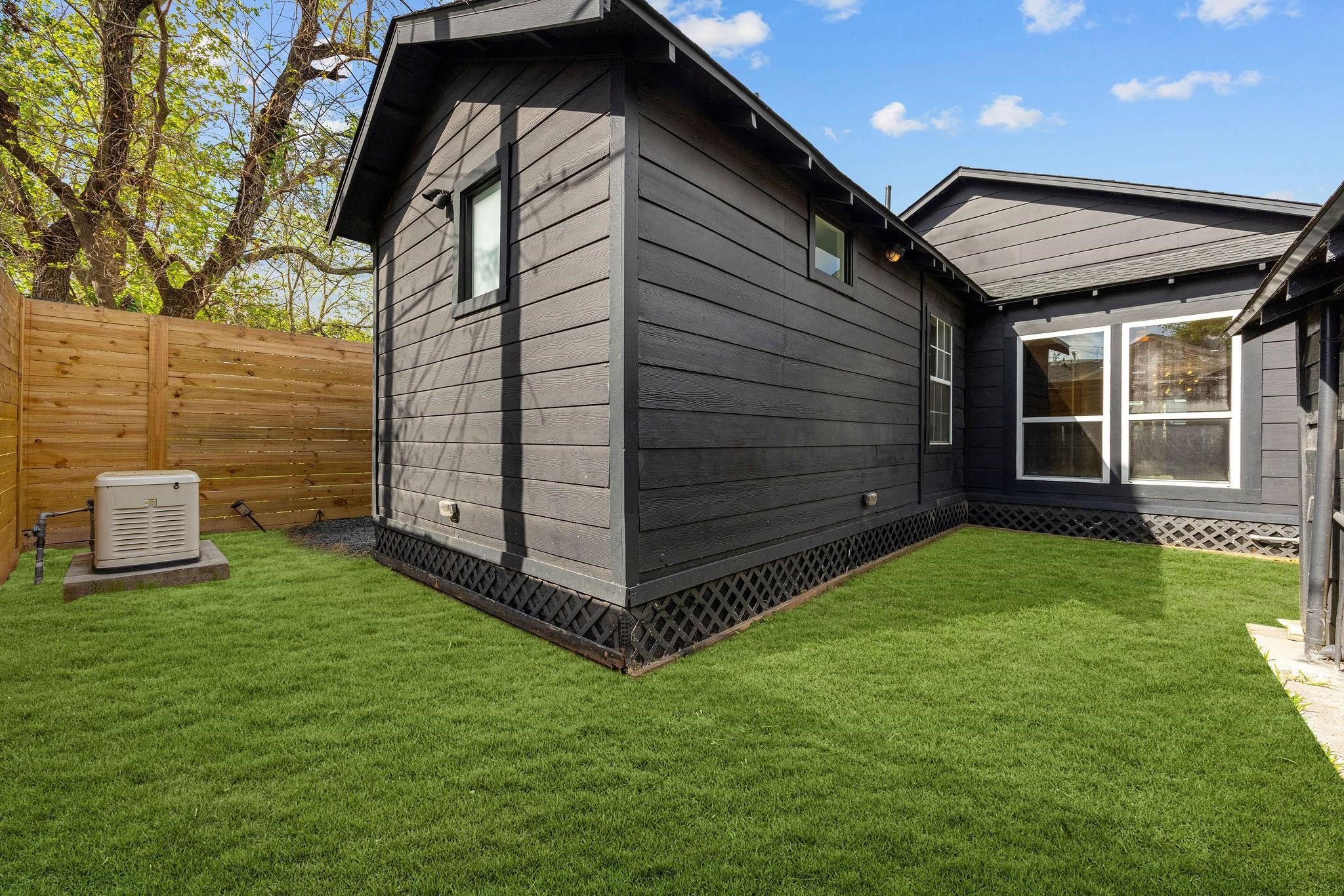 1310 Walton Street Houston, TX 77009 - Photo 17 of 19 Private yard space with fresh landscaping and room to enjoy outdoor living.