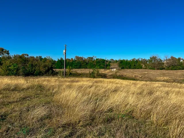 a view of a lake with a big yard