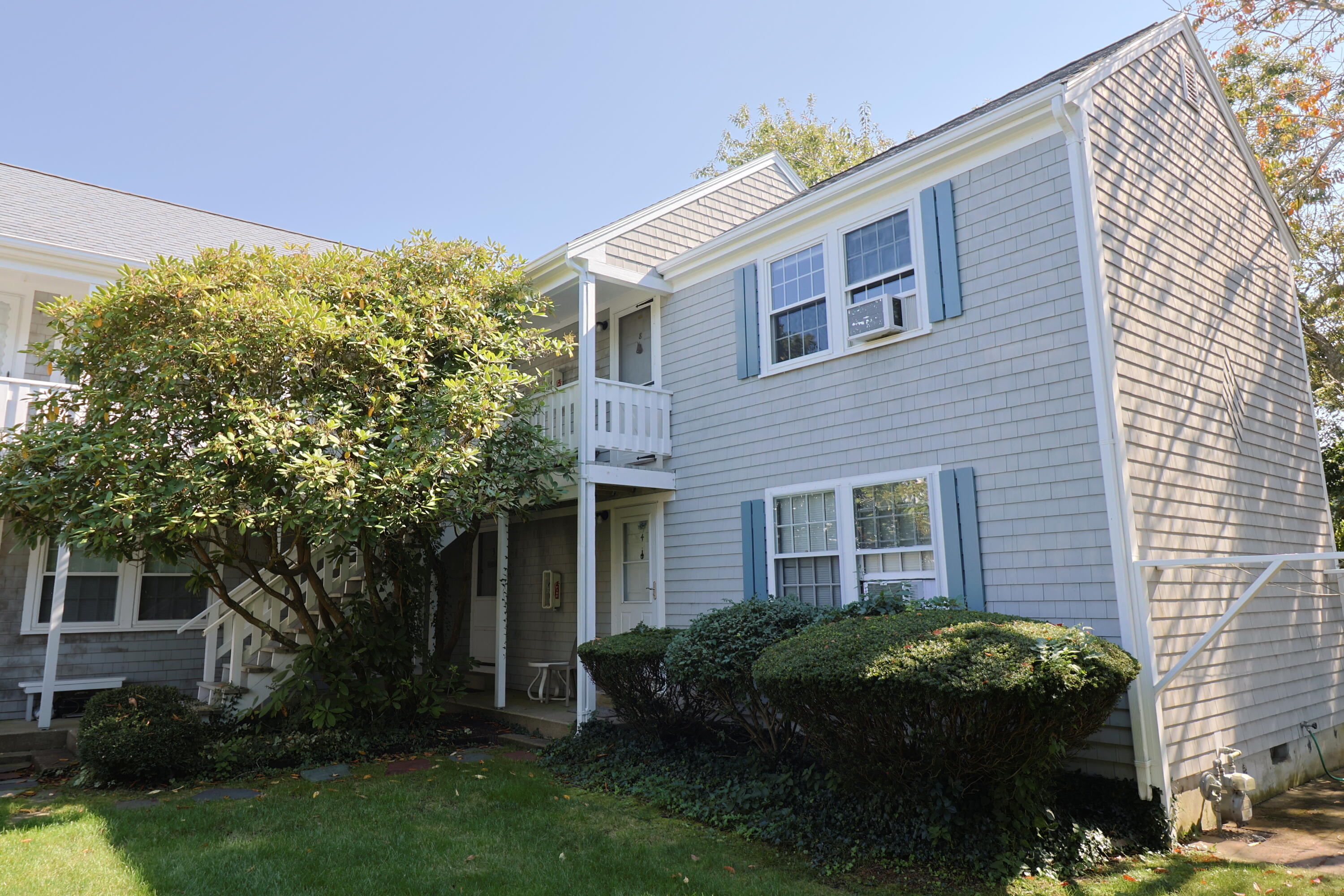 75 Beaten Road, Unit 8 Dennis Port, MA 02639 - Photo 1 of 24 a front view of a house with garden