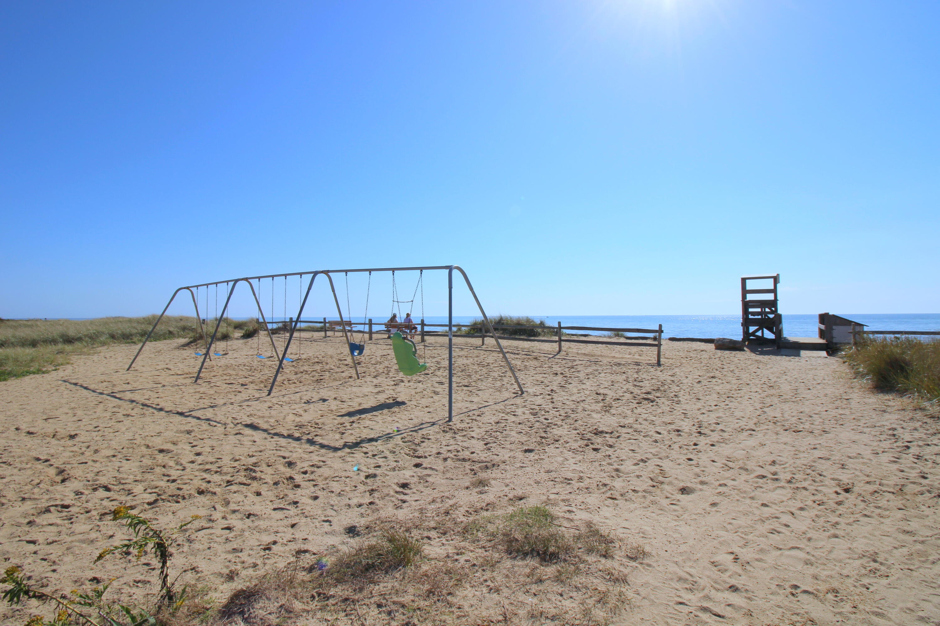 75 Beaten Road, Unit 8 Dennis Port, MA 02639 - Photo 23 of 24 a view of a beach with a yard