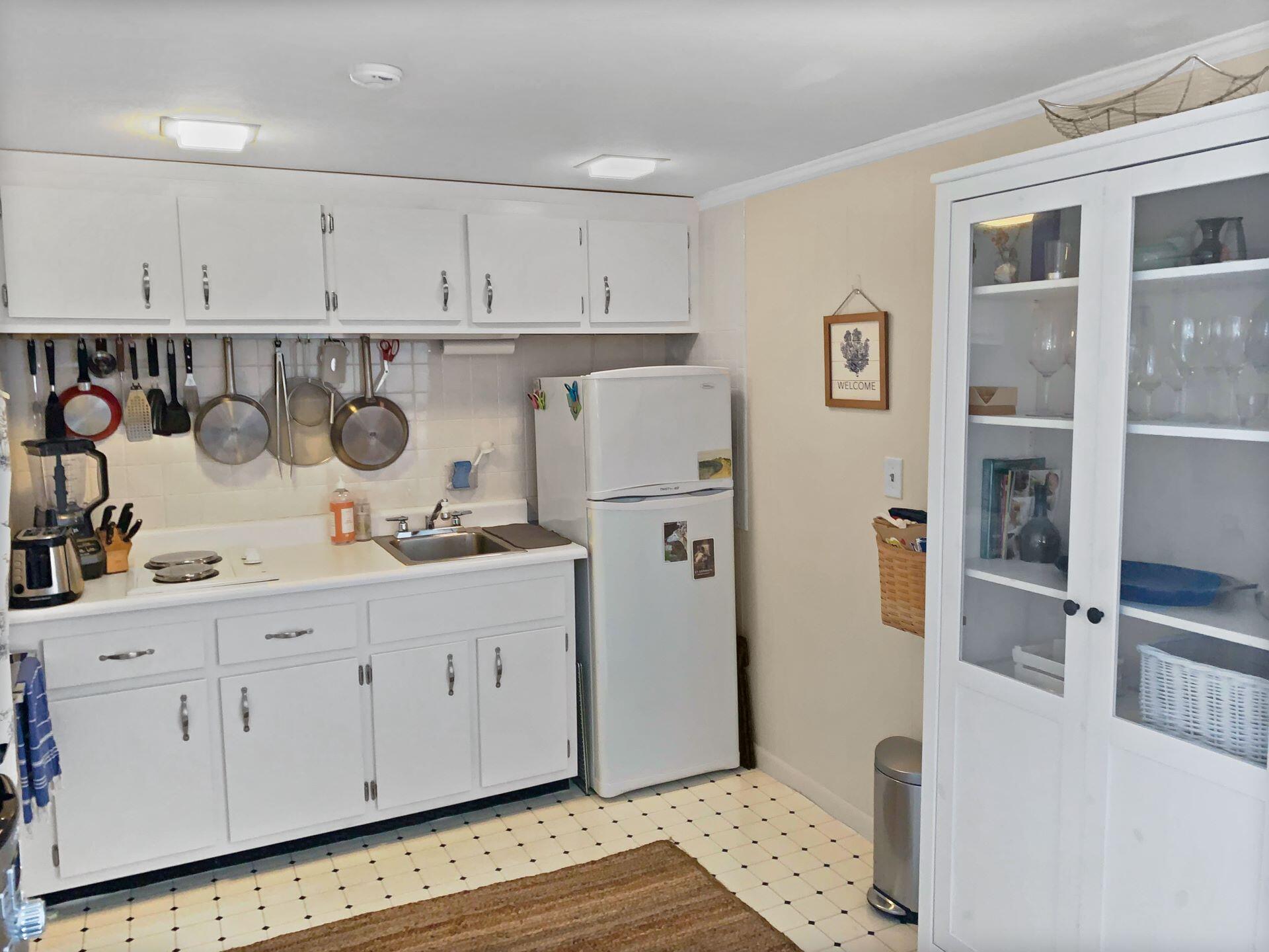 75 Beaten Road, Unit 8 Dennis Port, MA 02639 - Photo 5 of 24 a kitchen with stainless steel appliances granite countertop a refrigerator and a stove