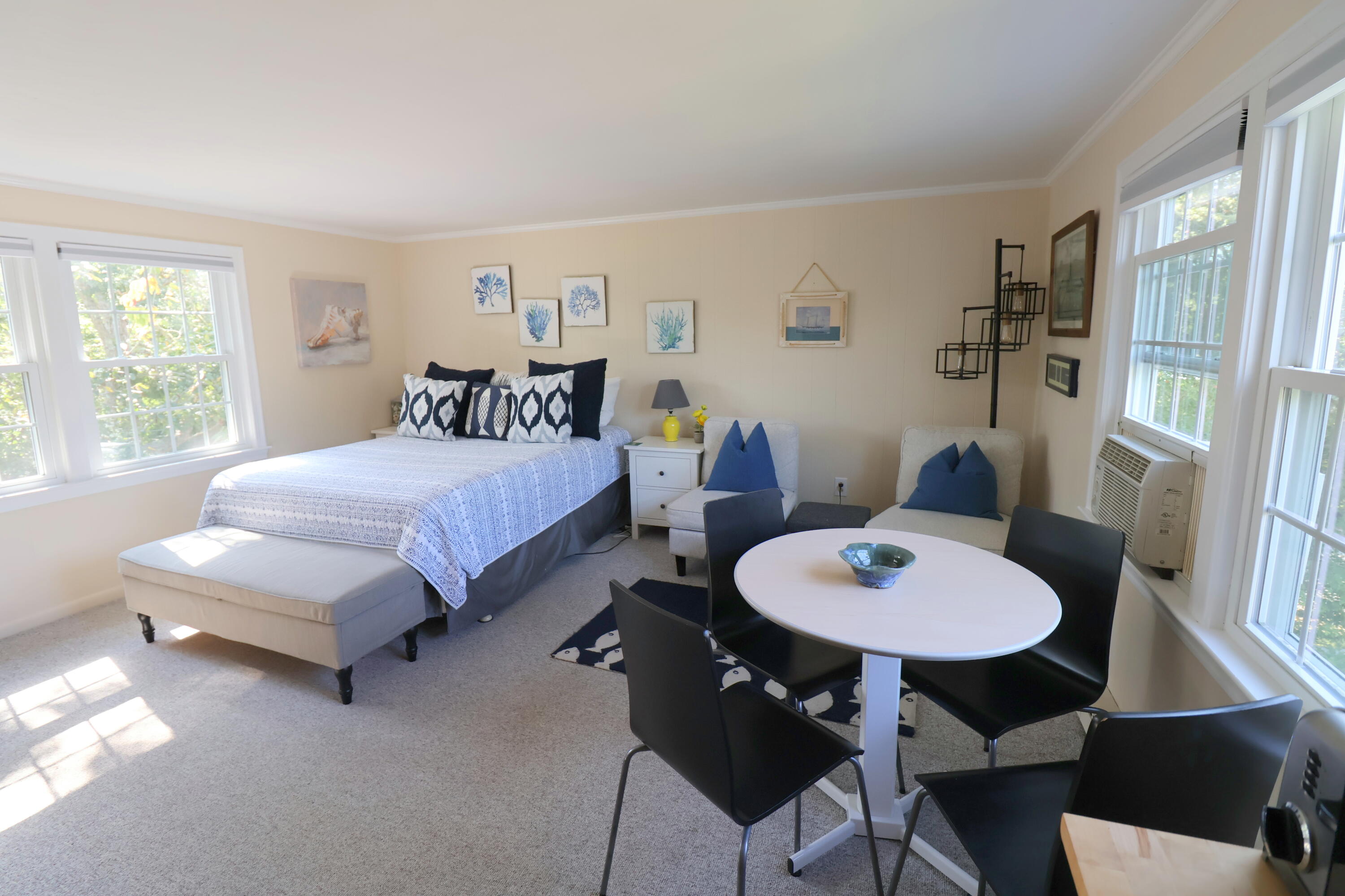 75 Beaten Road, Unit 8 Dennis Port, MA 02639 - Photo 8 of 24 a bedroom with a bed a table and chair with the wooden floor