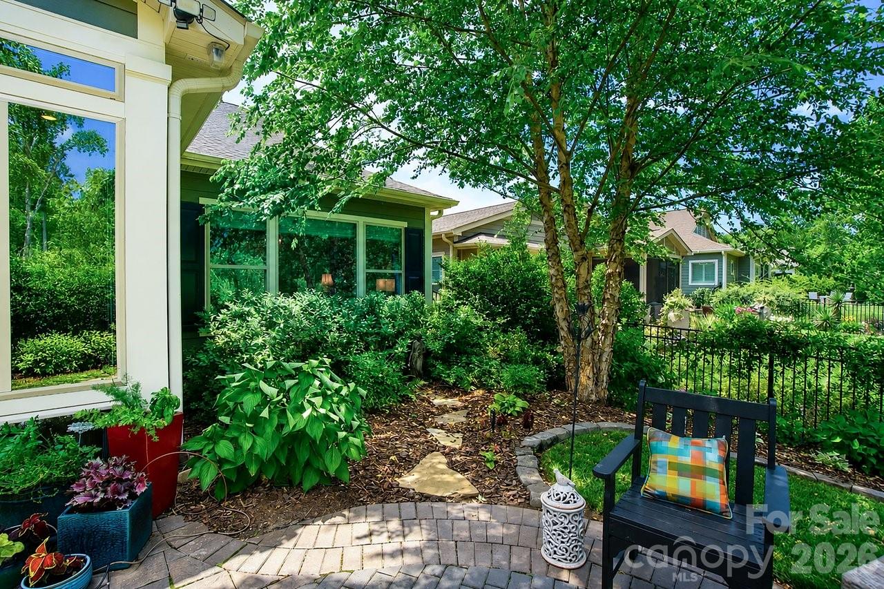 4854 Looking Glass Trail Denver, NC 28037 - Photo 24 of 48 a front view of a house with a yard and potted plants