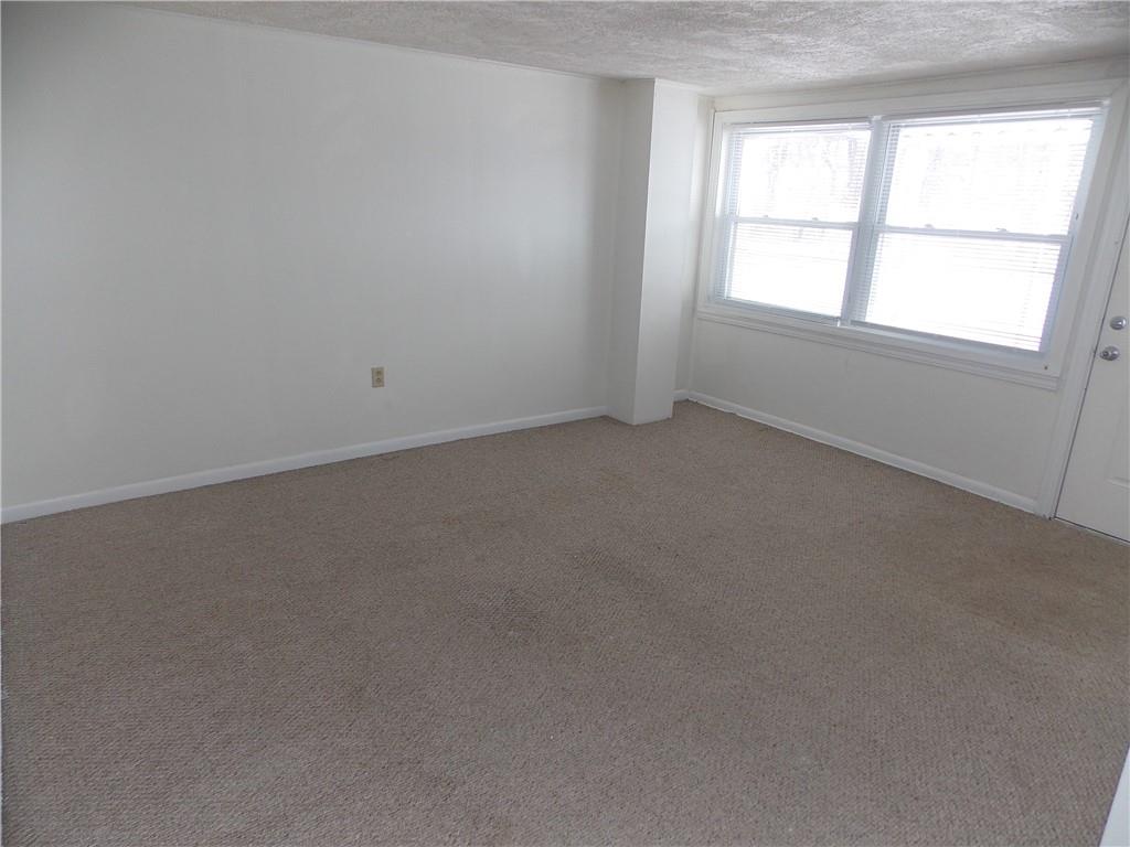 110 Saltarka Road, Unit 3 Zelienople, PA 16063 - Photo 4 of 8 Living room with large window for natural sunlight