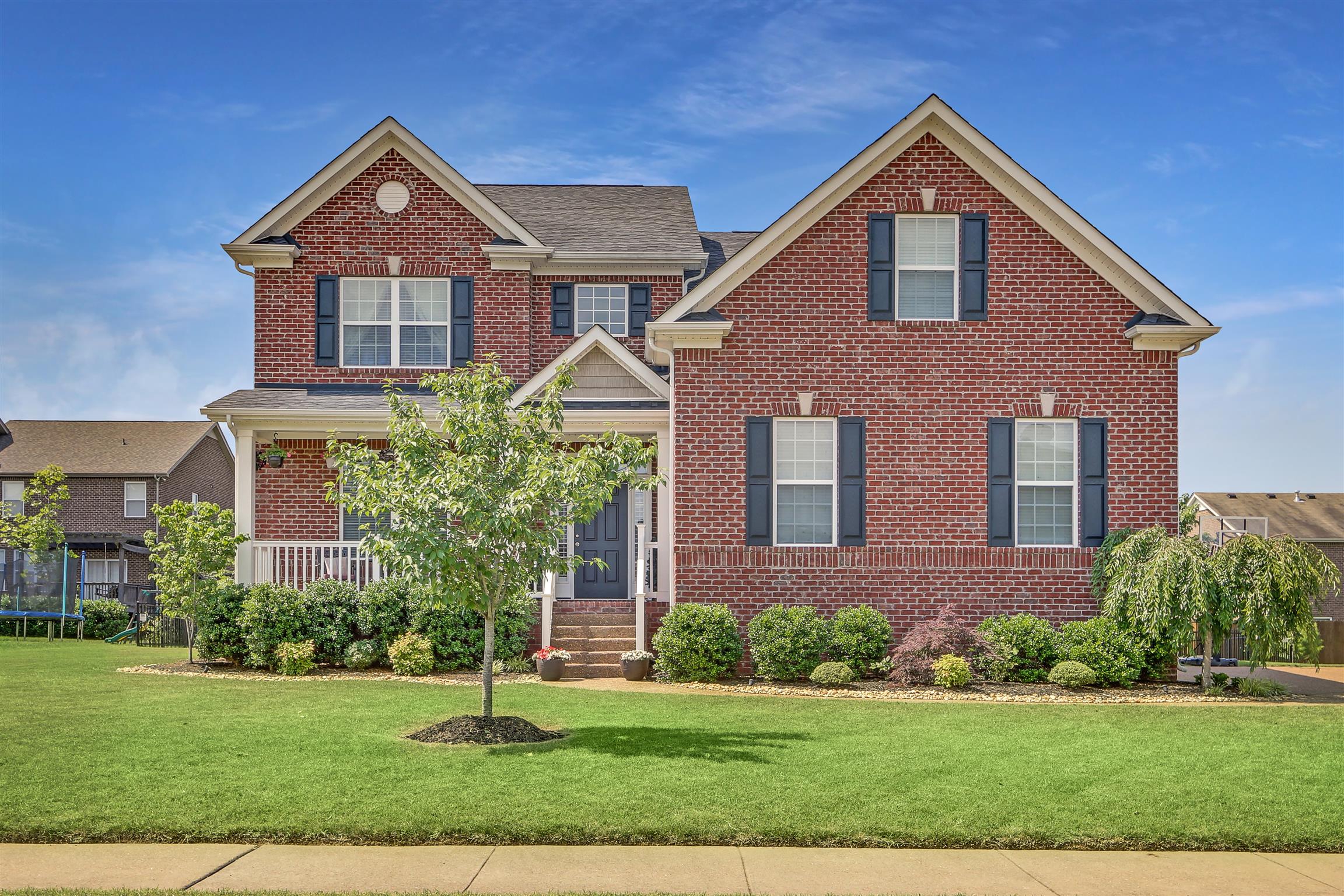 3005 Langston Place Spring Hill, TN 37174 - Photo 1 of 30 a front view of a house with a yard