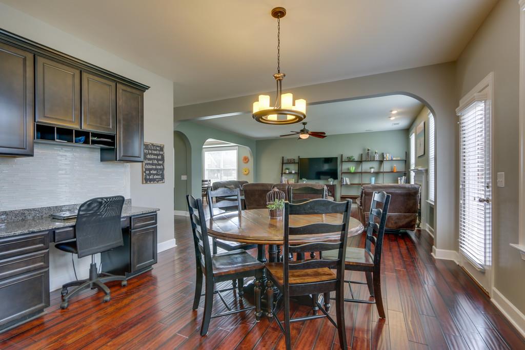 3005 Langston Place Spring Hill, TN 37174 - Photo 11 of 30 a view of a dining room with furniture window and wooden floor