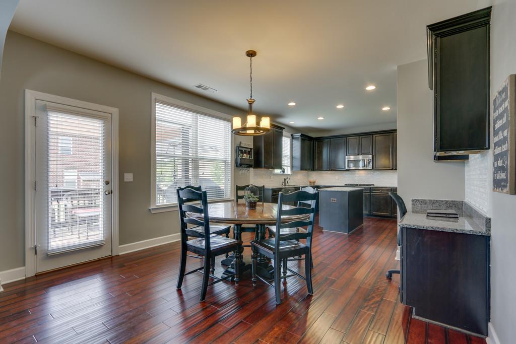 3005 Langston Place Spring Hill, TN 37174 - Photo 12 of 30 a view of a dining room with furniture window and wooden floor