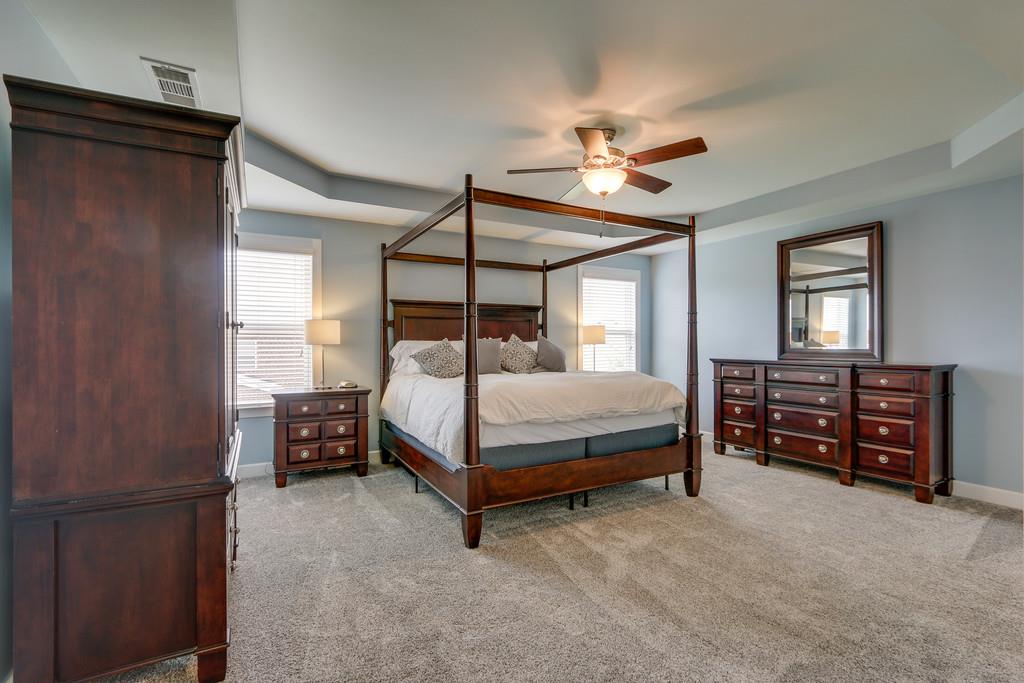 3005 Langston Place Spring Hill, TN 37174 - Photo 19 of 30 a bedroom with a bed dresser and a window