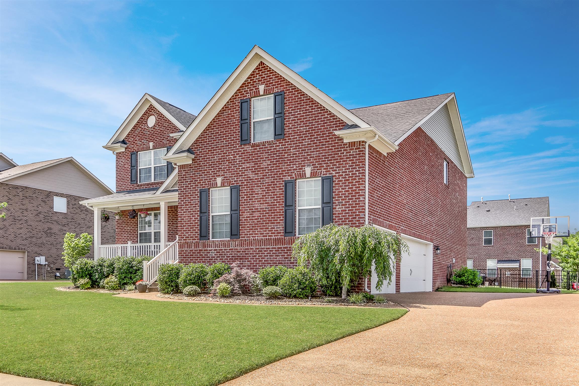 3005 Langston Place Spring Hill, TN 37174 - Photo 3 of 30 a front view of a house with a yard