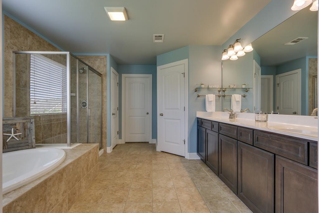 3005 Langston Place Spring Hill, TN 37174 - Photo 20 of 30 a bathroom with a sink tub shower and a mirror