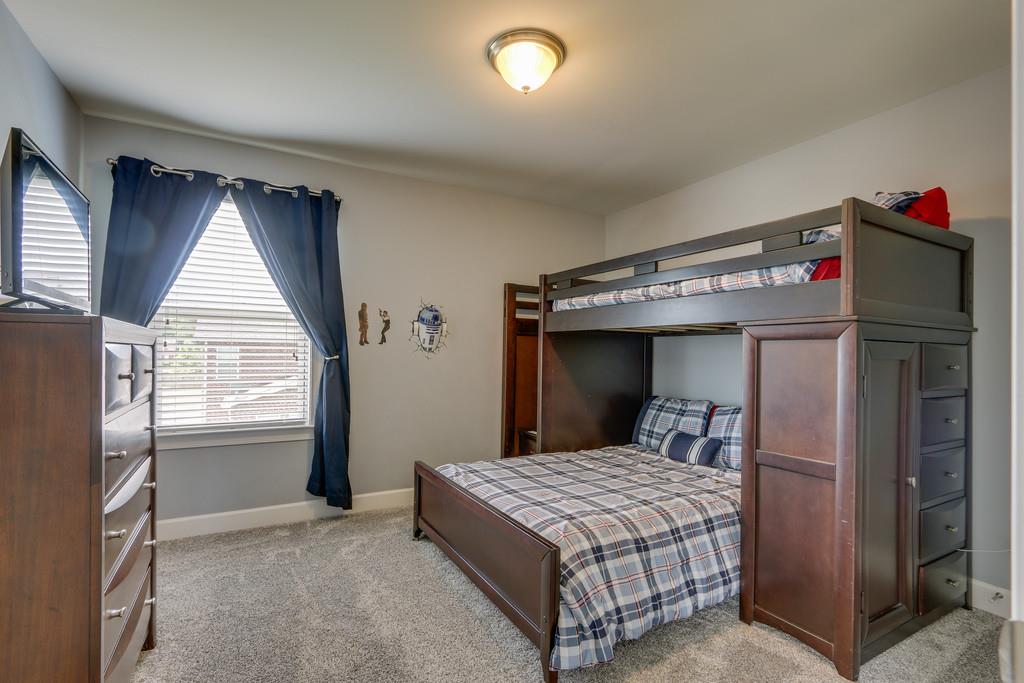 3005 Langston Place Spring Hill, TN 37174 - Photo 22 of 30 a bedroom with a bed and window