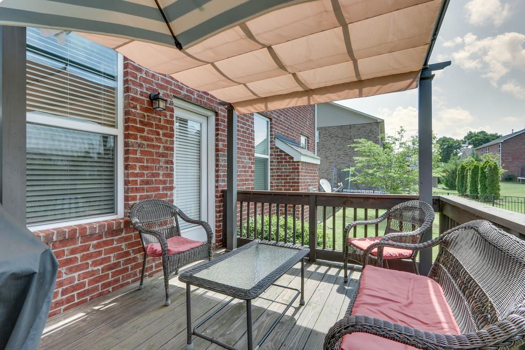 3005 Langston Place Spring Hill, TN 37174 - Photo 27 of 30 a balcony with furniture and wooden floor