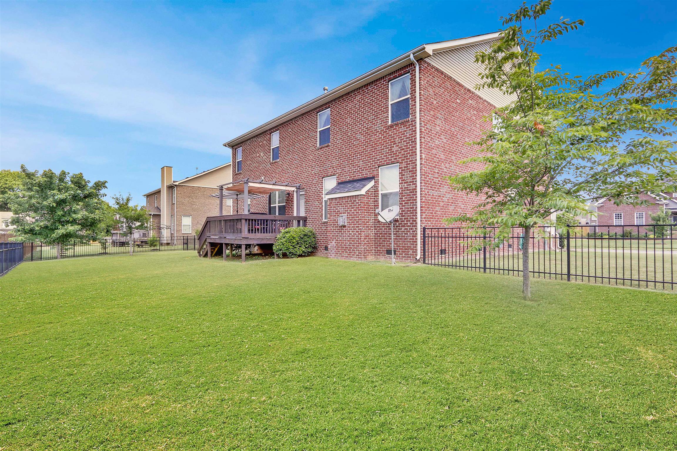 3005 Langston Place Spring Hill, TN 37174 - Photo 29 of 30 a view of a house with a backyard