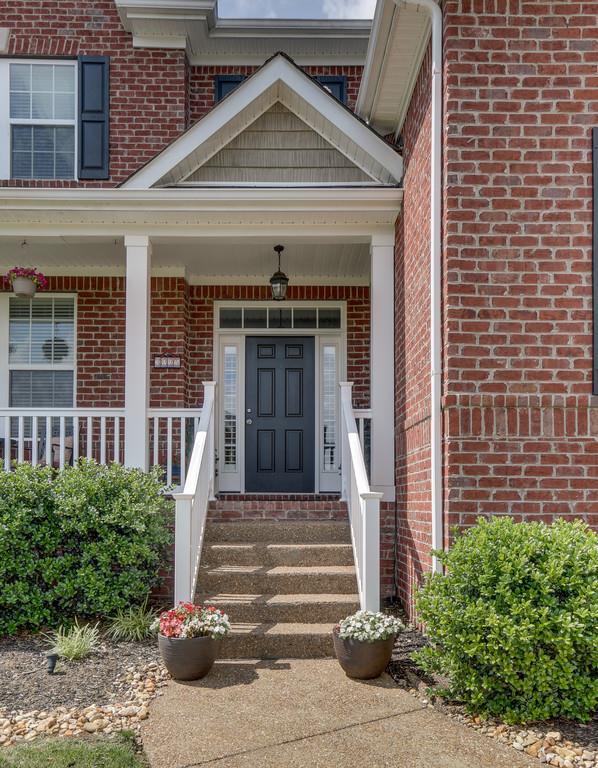 3005 Langston Place Spring Hill, TN 37174 - Photo 4 of 30 a front view of a house with a yard