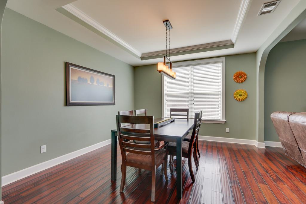 3005 Langston Place Spring Hill, TN 37174 - Photo 8 of 30 a view of a dining room with furniture window and wooden floor