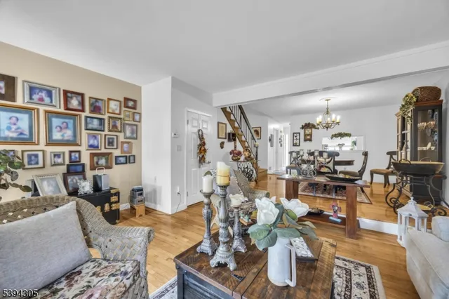 a bedroom with furniture and a flat screen tv