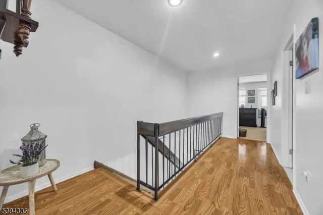 a bedroom with a bed and closet with mirror