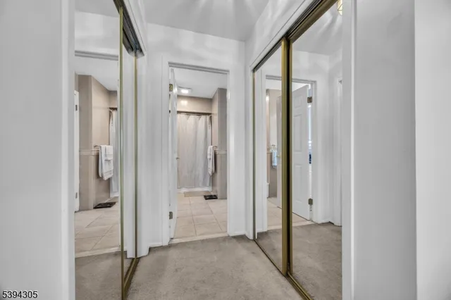 a view of a storage and utility room with washer and dryer