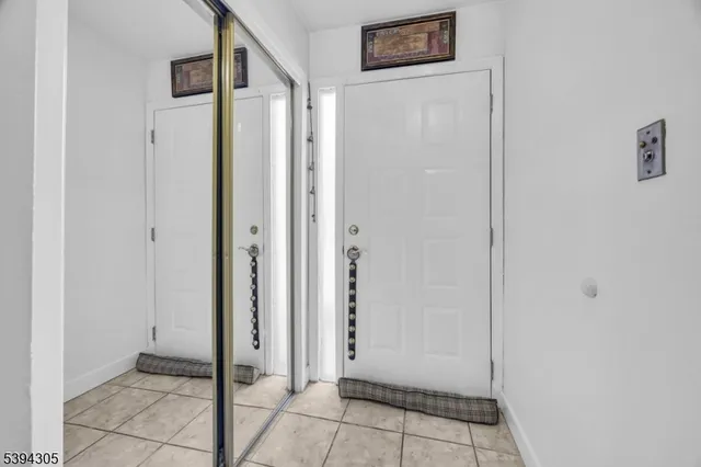 a view of an entryway with front door