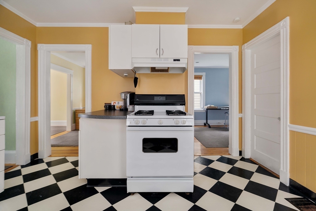 18-20 Windom Street Somerville, MA 02144 - Photo 25 of 34 a kitchen with a stove and a refrigerator