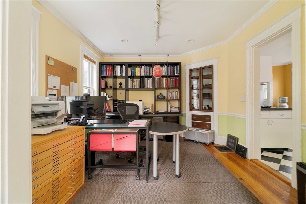 18-20 Windom Street Somerville, MA 02144 - Photo 27 of 34 a work room with furniture a bookshelf and a window