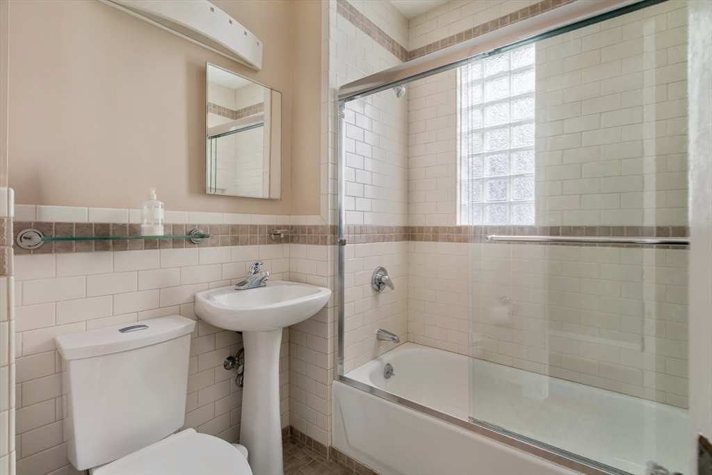 18-20 Windom Street Somerville, MA 02144 - Photo 29 of 34 a bathroom with a sink a toilet and shower