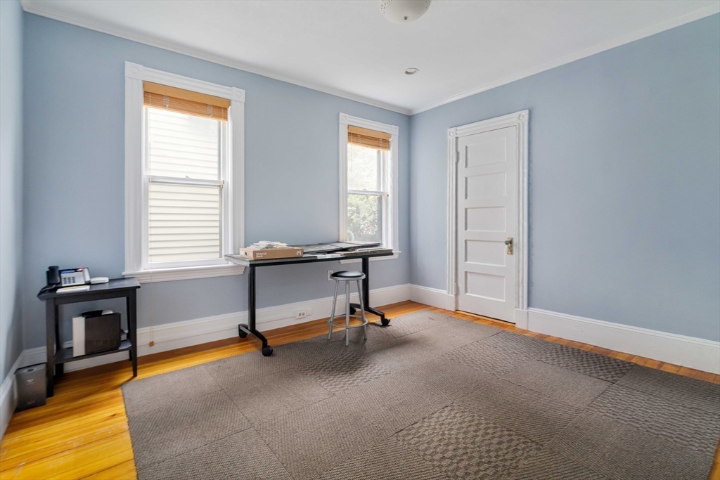 18-20 Windom Street Somerville, MA 02144 - Photo 30 of 34 a view of a livingroom with workspace and a window