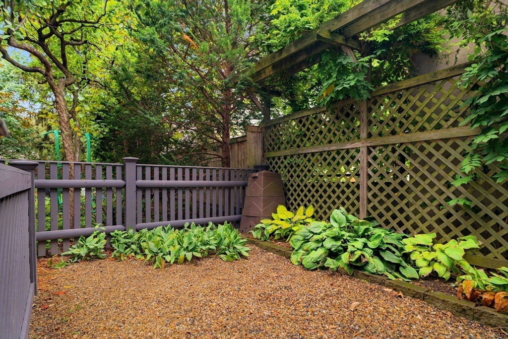 18-20 Windom Street Somerville, MA 02144 - Photo 31 of 34 a garden covered with wooden fence