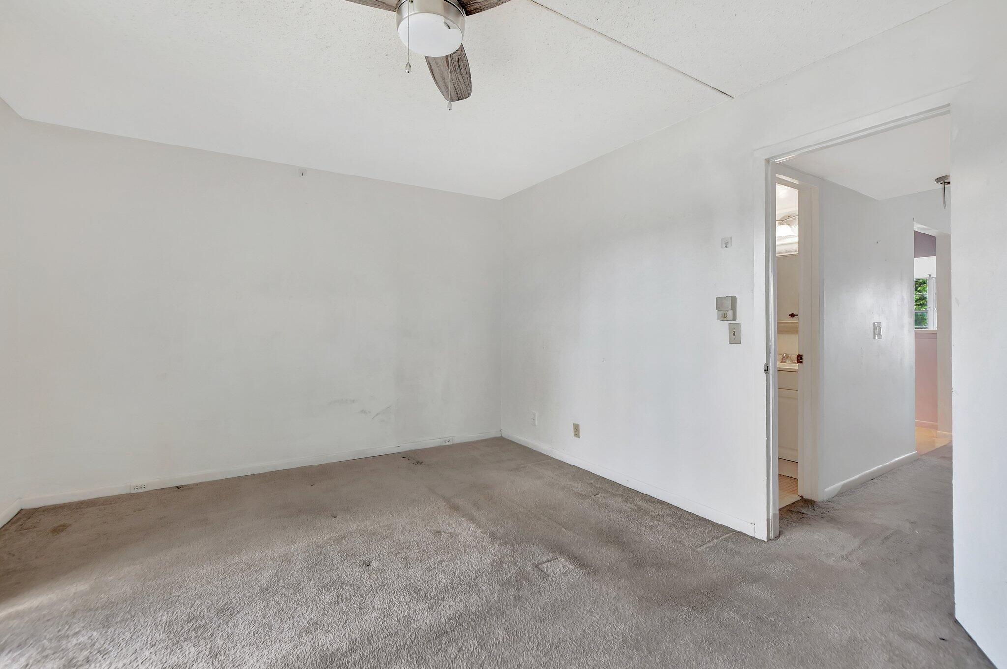 147 Brighton D, Unit D Boca Raton, FL 33434 - Photo 11 of 50 wooden floor in an empty room