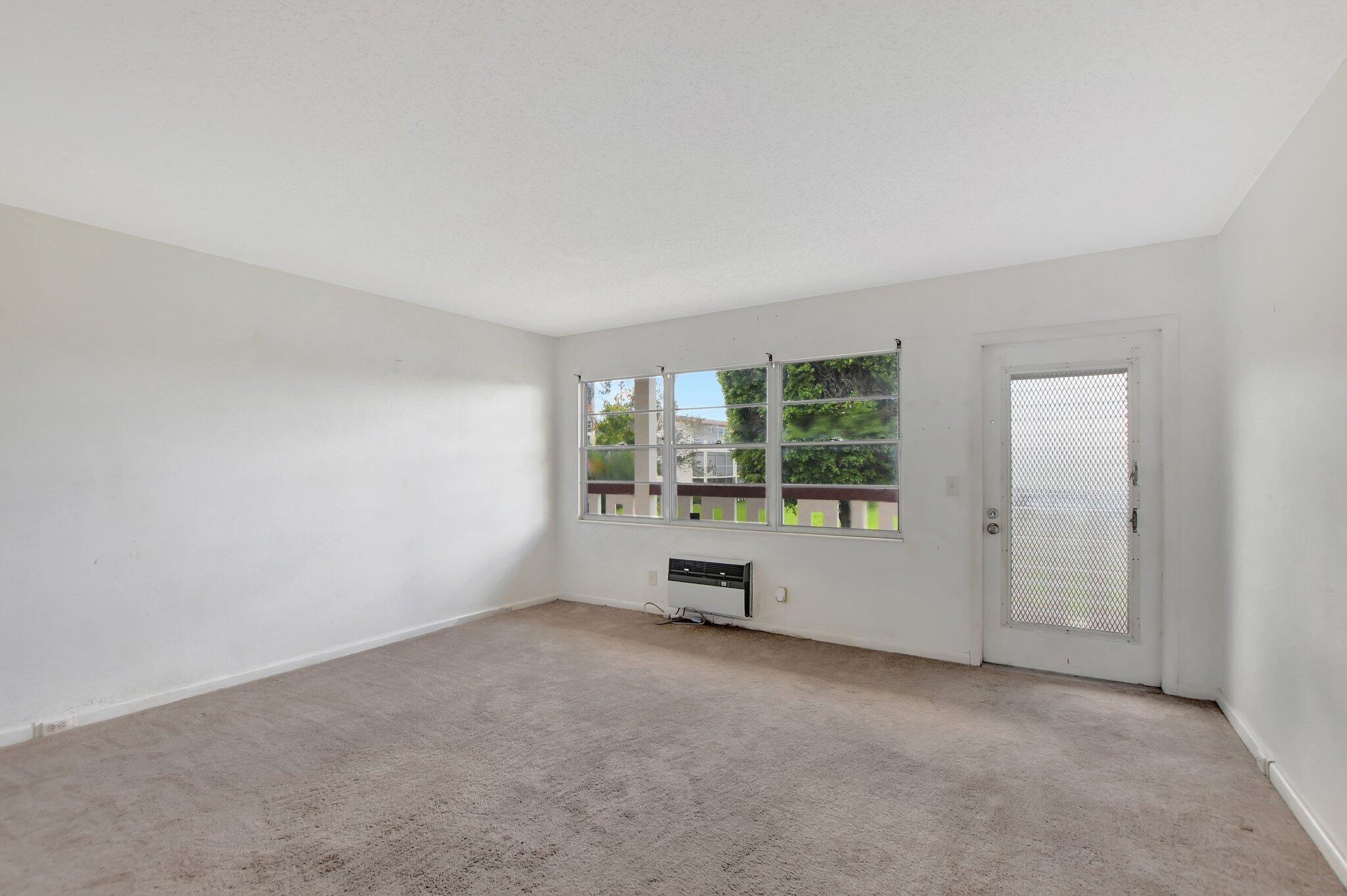 147 Brighton D, Unit D Boca Raton, FL 33434 - Photo 13 of 50 an empty room with windows