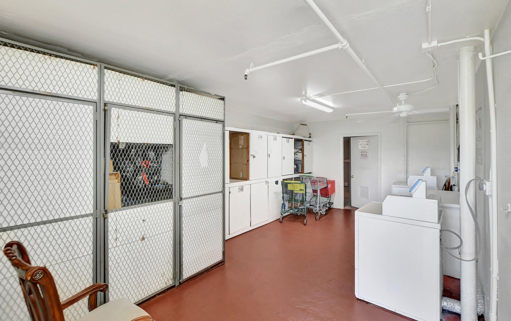 147 Brighton D, Unit D Boca Raton, FL 33434 - Photo 19 of 50 a living room with furniture and a refrigerator