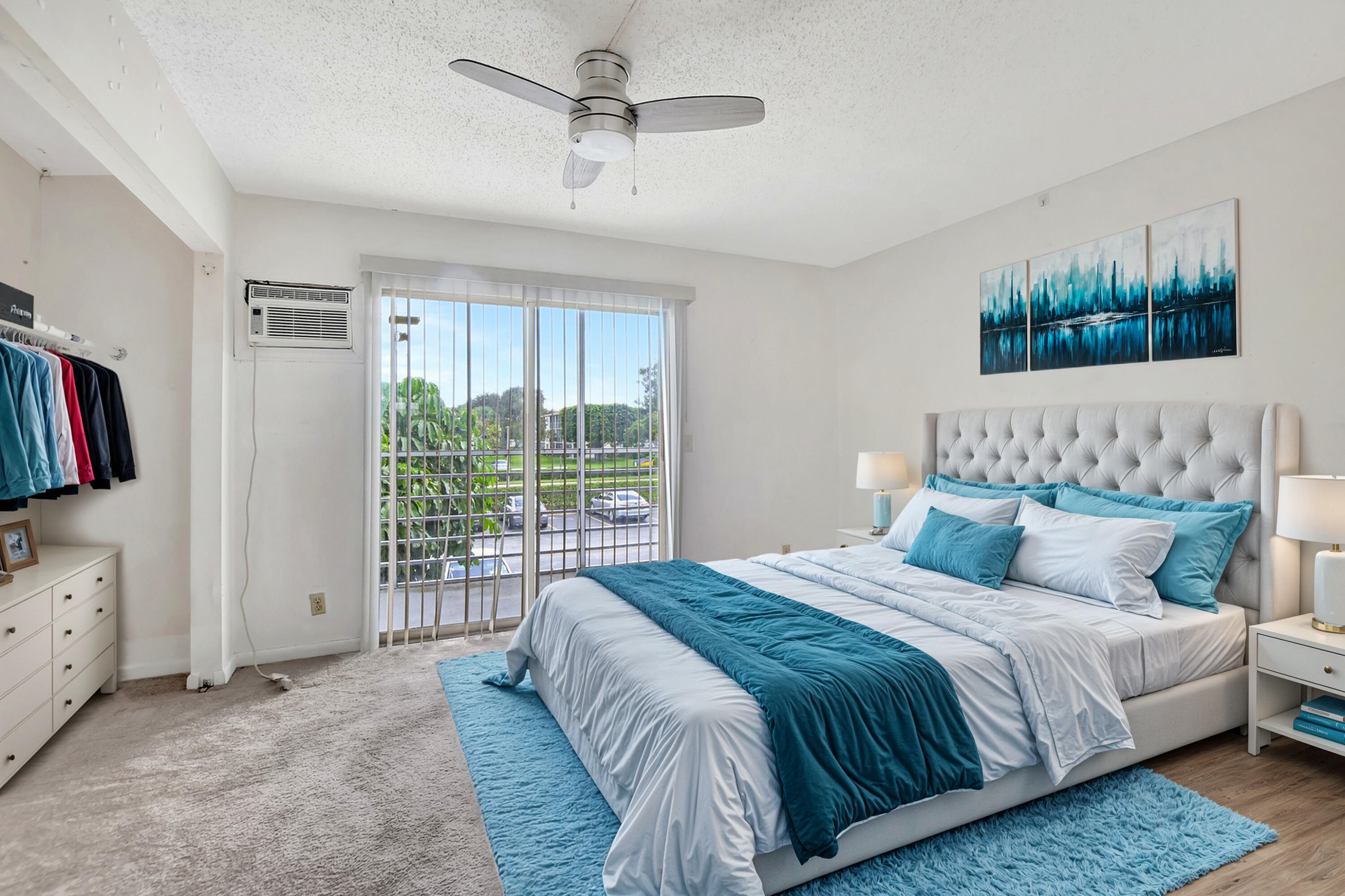 147 Brighton D, Unit D Boca Raton, FL 33434 - Photo 3 of 50 a bedroom with a large bed and a window