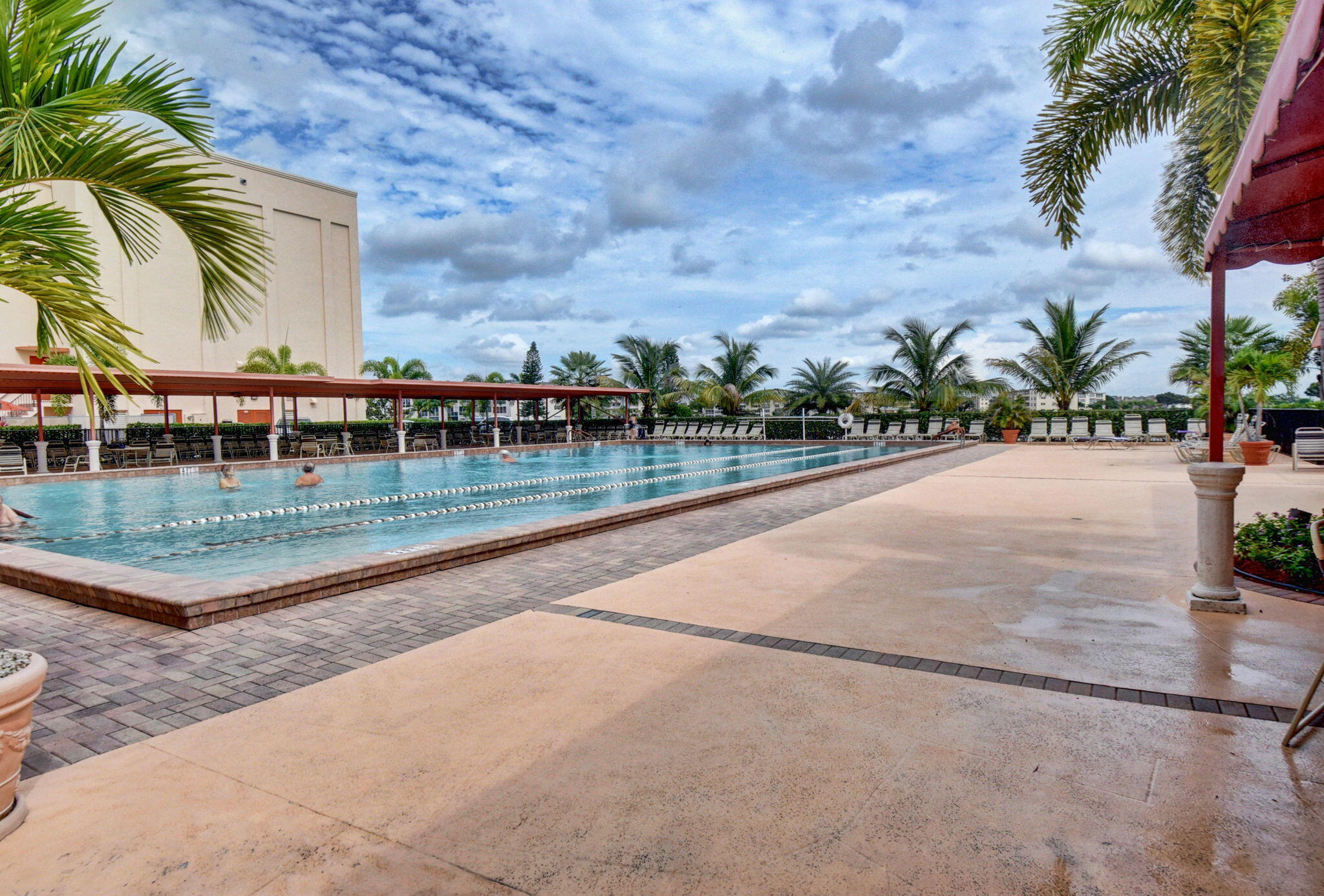 147 Brighton D, Unit D Boca Raton, FL 33434 - Photo 31 of 50 an outdoor view with swimming pool