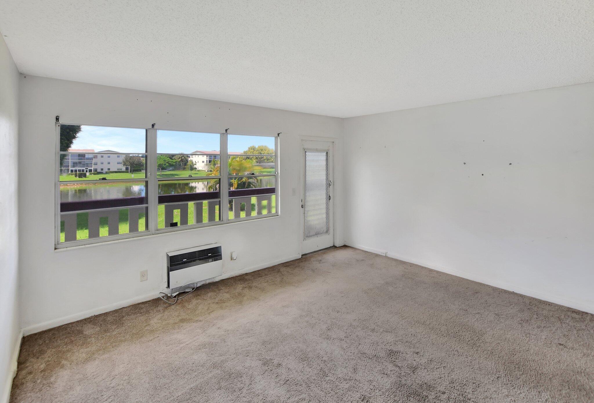 147 Brighton D, Unit D Boca Raton, FL 33434 - Photo 50 of 50 an empty room with large window