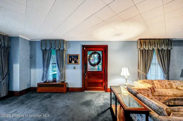 a dining room with furniture and window