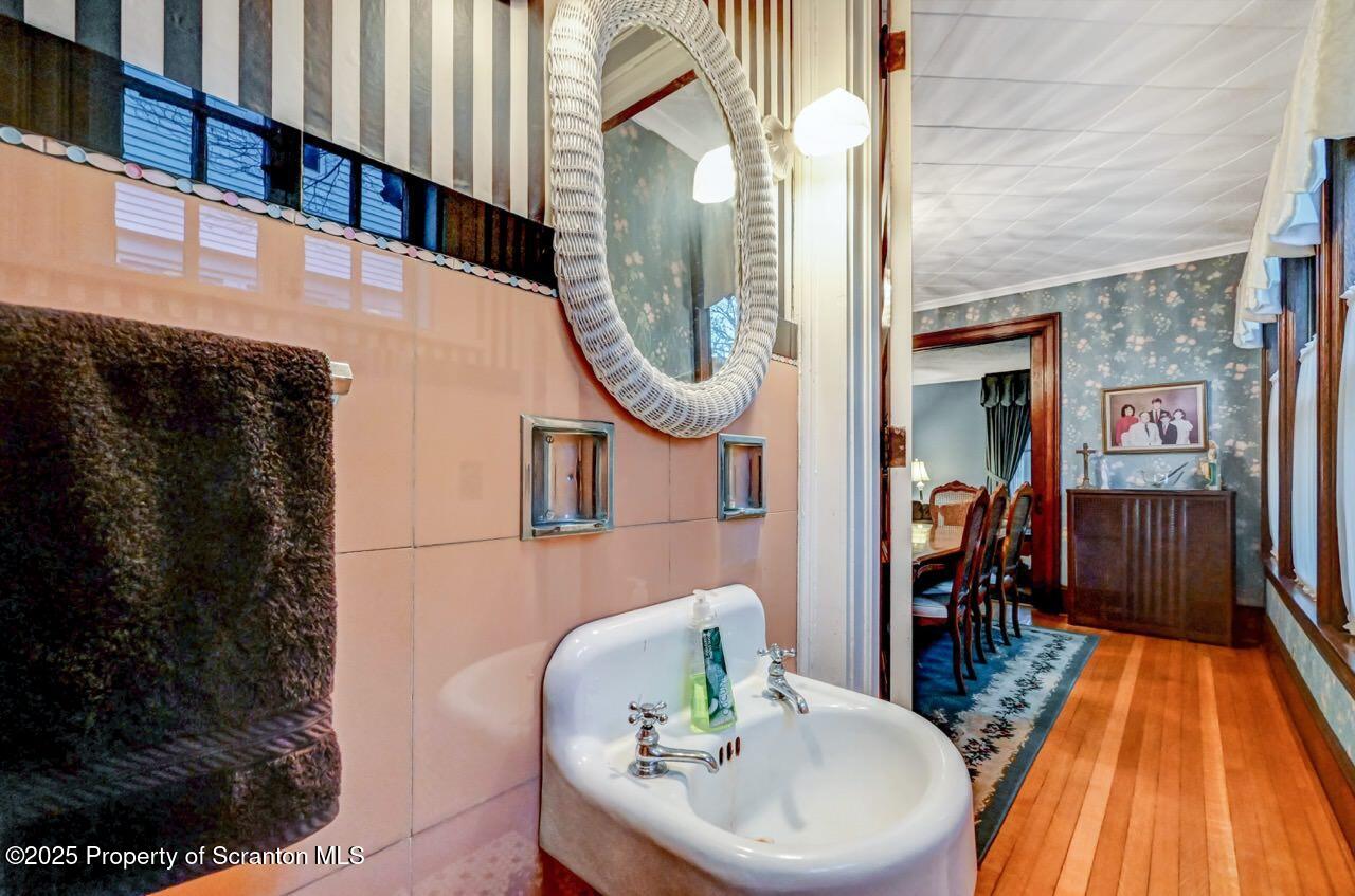 1008 Sunset Street Scranton, PA 18509 - Photo 19 of 54 a dining room with furniture and wooden floor