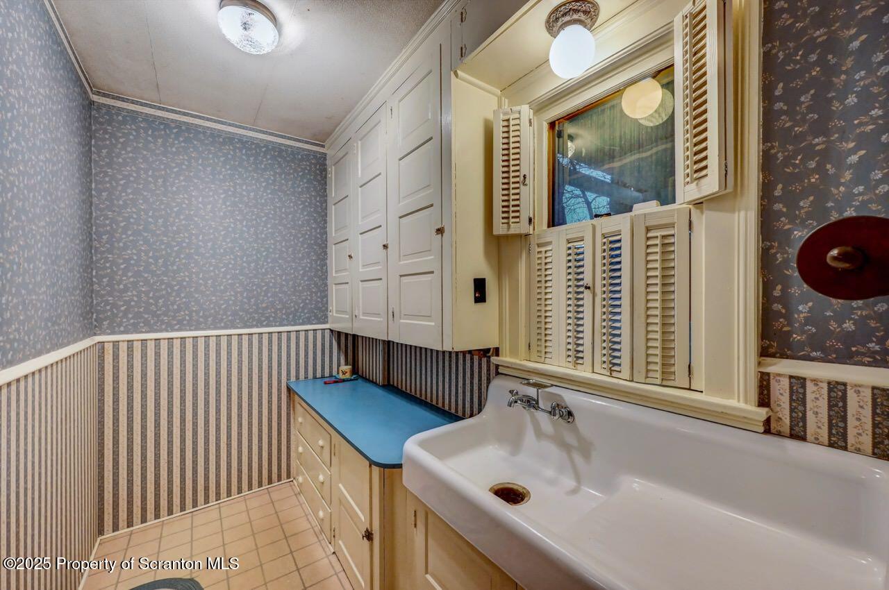 1008 Sunset Street Scranton, PA 18509 - Photo 21 of 54 a bathroom with a sink and tub