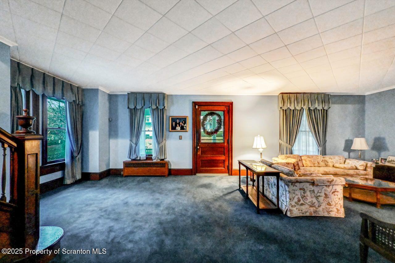 1008 Sunset Street Scranton, PA 18509 - Photo 22 of 54 a room with furniture and a flat screen tv