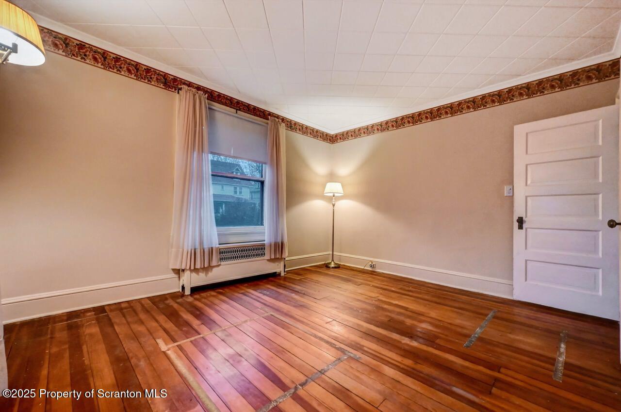 1008 Sunset Street Scranton, PA 18509 - Photo 29 of 54 a view of an empty room with wooden floor