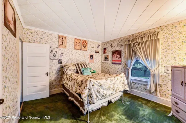 a bedroom with a bed and a closet