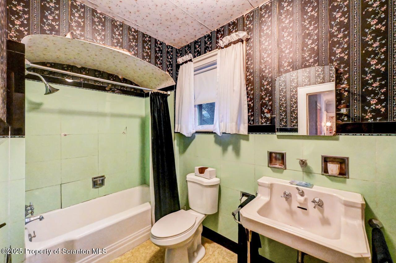 1008 Sunset Street Scranton, PA 18509 - Photo 35 of 54 a bathroom with a sink toilet and shower