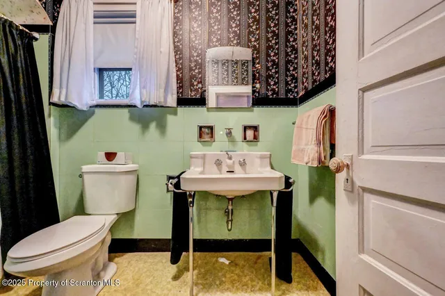 a bedroom with a bed and cabinet