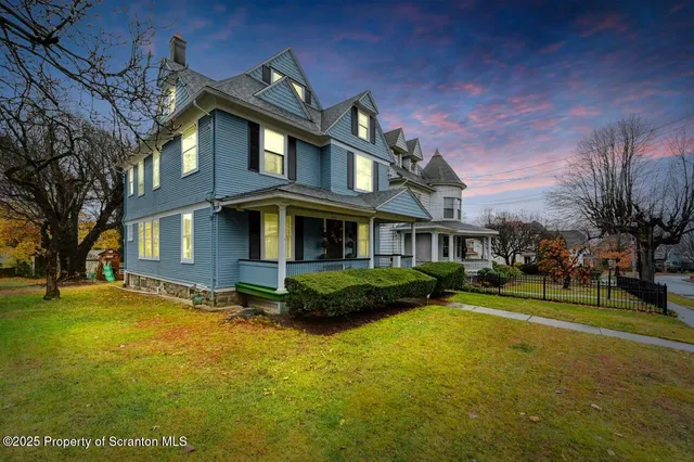 a front view of a building with garden