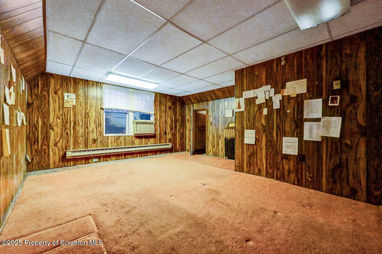 1008 Sunset Street Scranton, PA 18509 - Photo 46 of 54 a view of an empty room with wooden walls